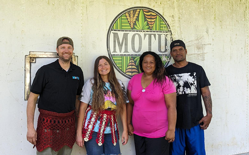 4 Motu Juice staff pose for a photo in front of the office